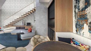 A modern interior with a staircase, seating area, and a large wall mural. - JEN Kunming by Shangri-la (Kunming)