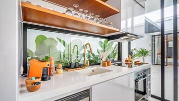 Full-sized fridge, stovetop, cookware/dishes/utensils