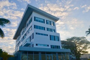 A multi-story building with a flat roof and large windows. - Holiday Homes - Newtown Apartment 1 (Nadi)