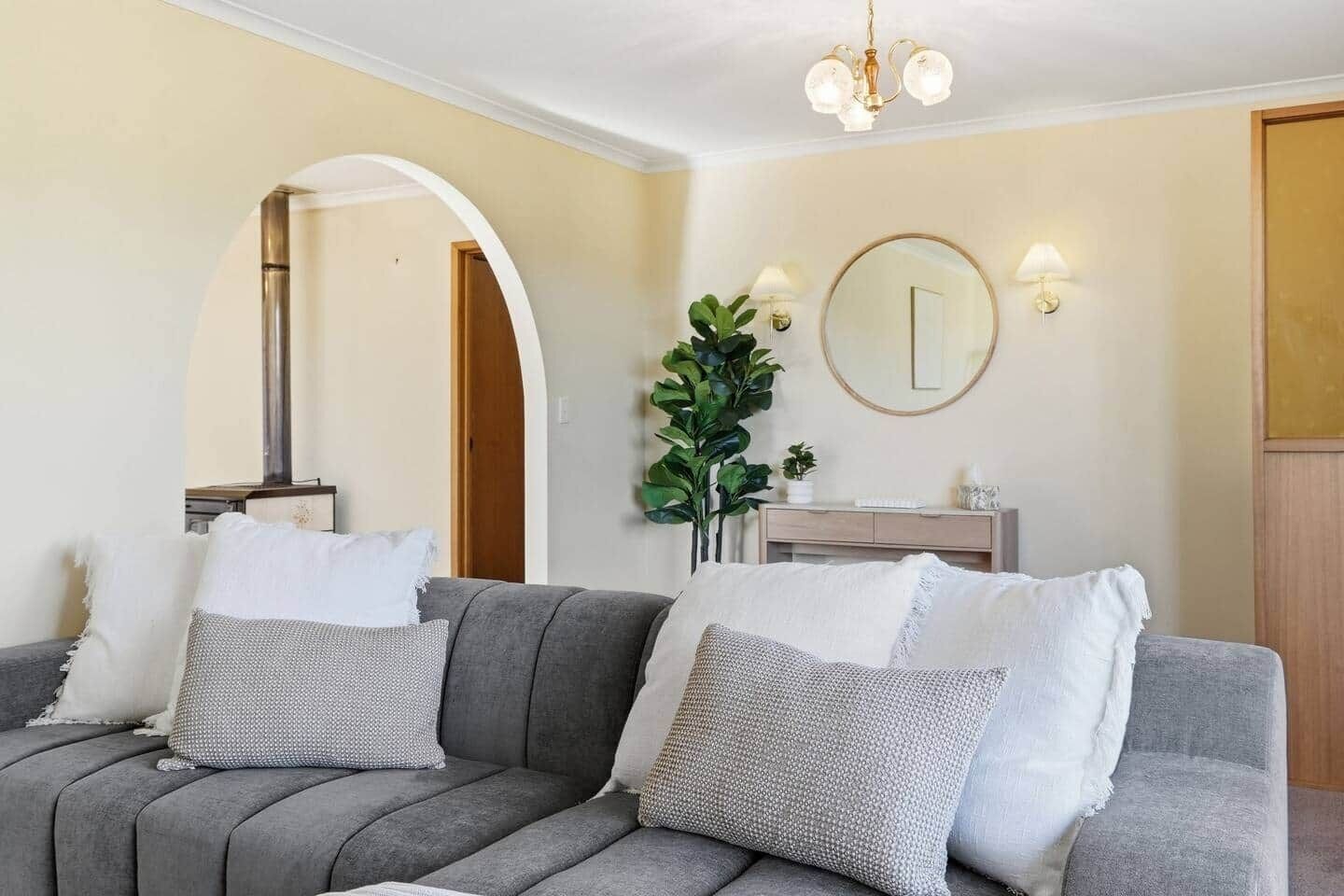 Modern living room with comfortable sofa and welcoming coastal-inspired décor.