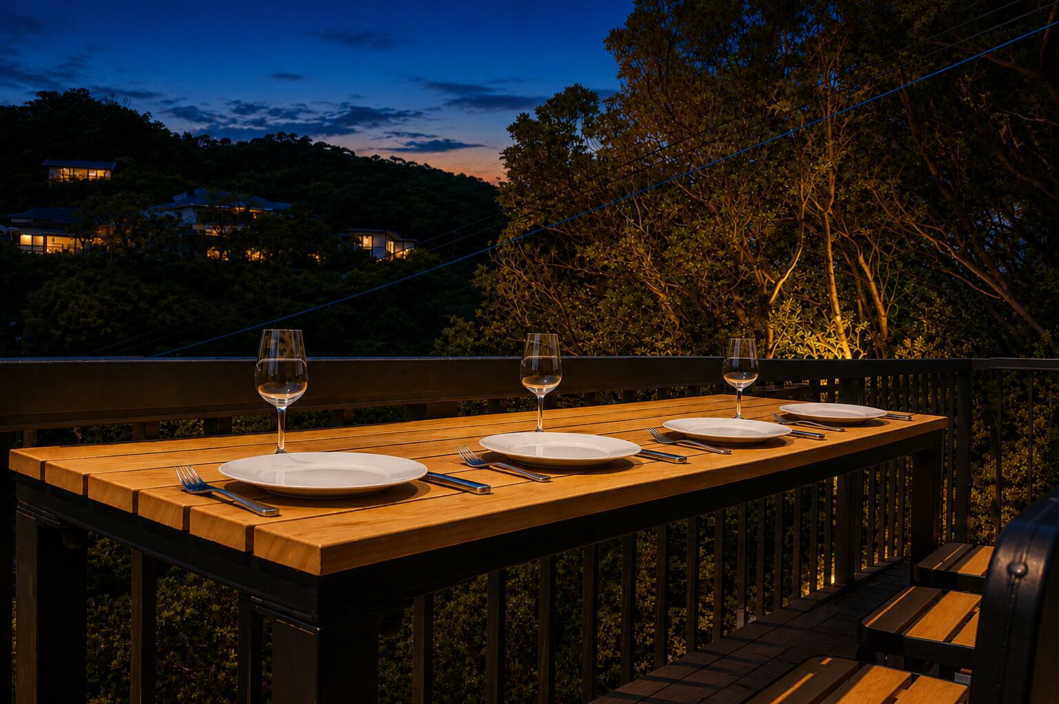 A wooden deck with a table set for three, overlooking a forested area.