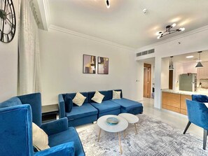 Living area - Yogi 1BR Pool Gym & Balcony JVC (Dubai)