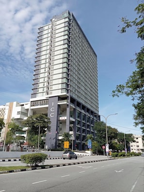 A multi-story building with a prominent 'ICC' sign, indicating a hotel or conference center. - ICC Luxury Suites Ipoh By Grab A Stay (Ipoh)