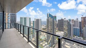 A balcony with a city view, featuring modern high-rise buildings and a clear sky. - Skyline Miami & Resort Amenities (Miami)