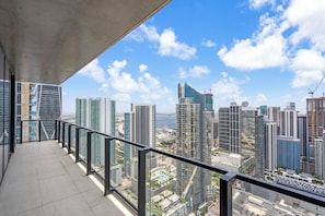 A balcony with a city view, featuring modern high-rise buildings and a clear sky. - Skyline Miami & Resort Amenities (Miami)