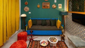 Deluxe suite, balkon, uitzicht op tuin | Woonruimte