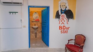 Deluxe suite, balkon, uitzicht op tuin | Badkamer
