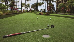 A miniature golf course with a putting green, a golf hole, and a golf ball. - Studio Ocean Front at Marriott's Maui Ocean Club - Molokai, Maui, & Lanai Towers (Lahaina)