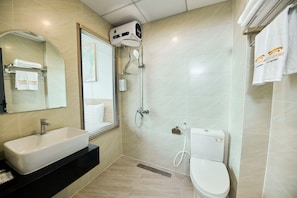 A bathroom with a sink, toilet, and shower. - CHERRY AIRPORT HOTEL AND APARTMENT 2 (Ho Chi Minh City)