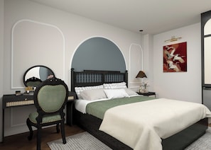 A bedroom with a bed, a chair, a desk, a mirror, and a wall-mounted lamp. - De Rond du Lac (Ba Đình)