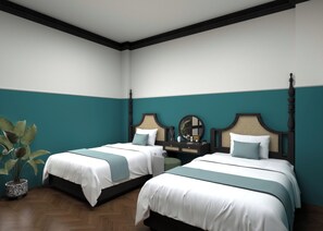A hotel room with two beds, a dresser, and a potted plant. - De Rond au Lac (Hanoi)