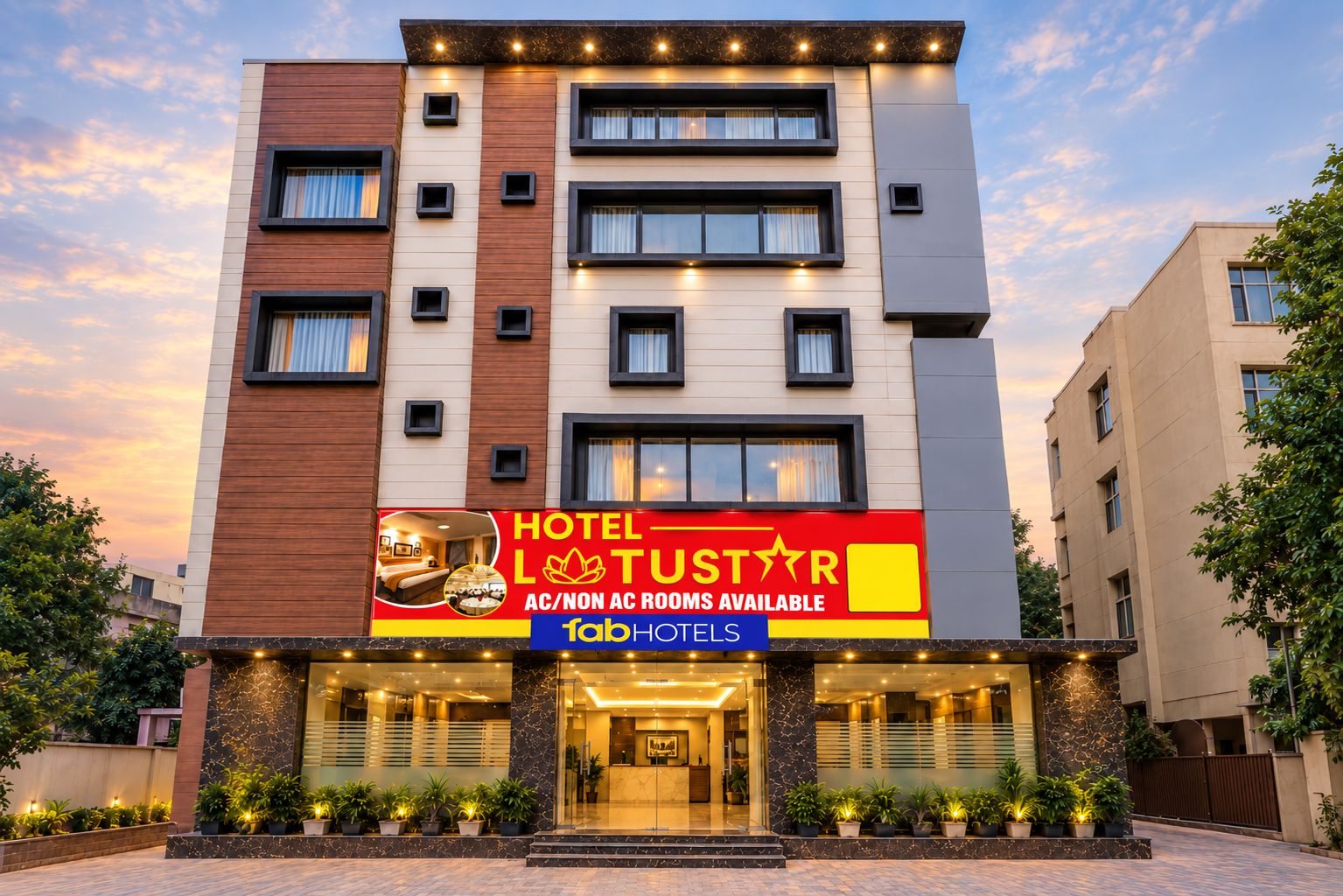 A multi-story hotel with a prominent sign advertising available rooms.