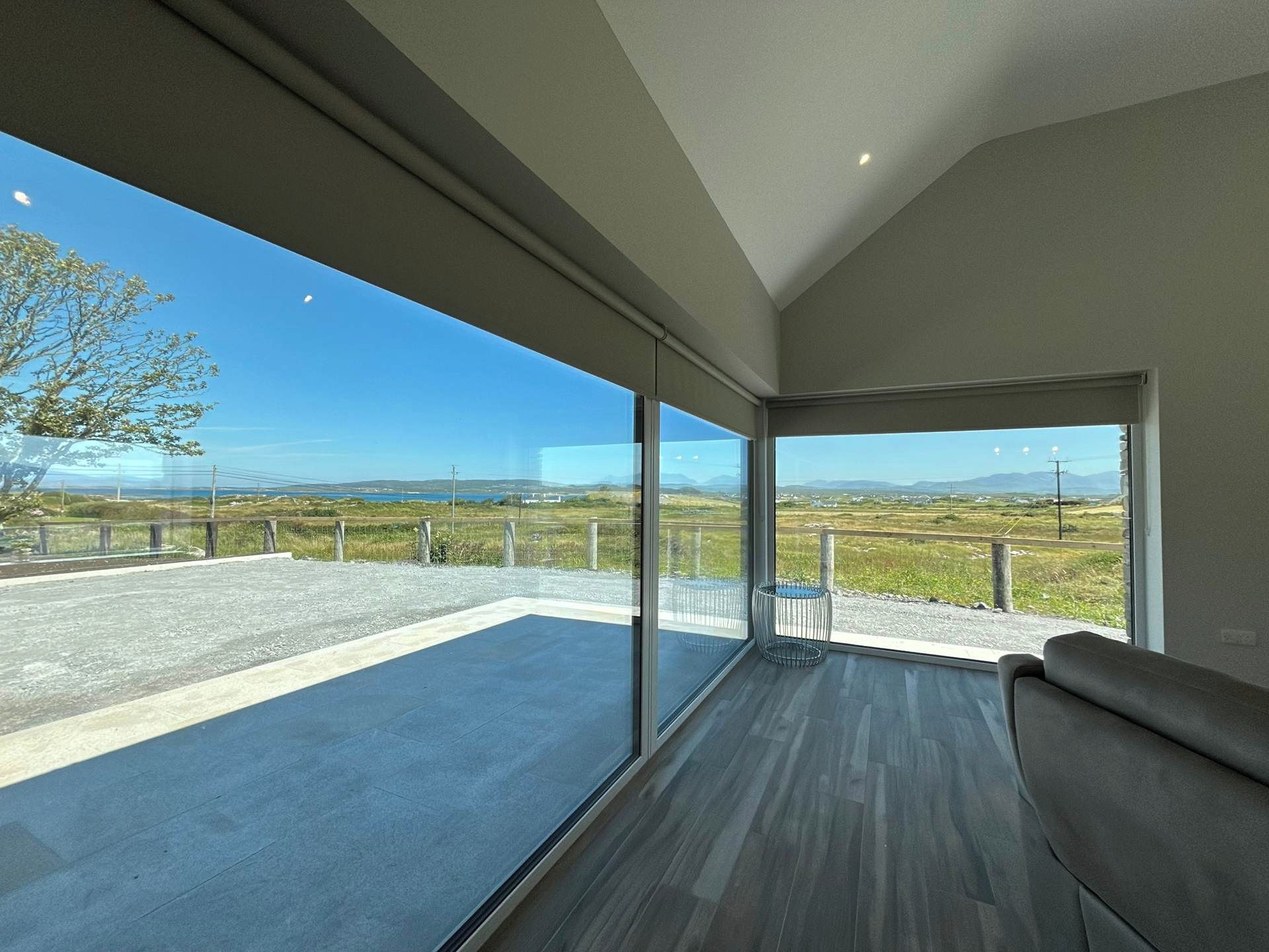 A spacious balcony with a clear view of the landscape.