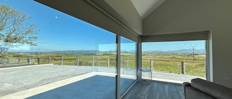 A spacious balcony with a clear view of the landscape.