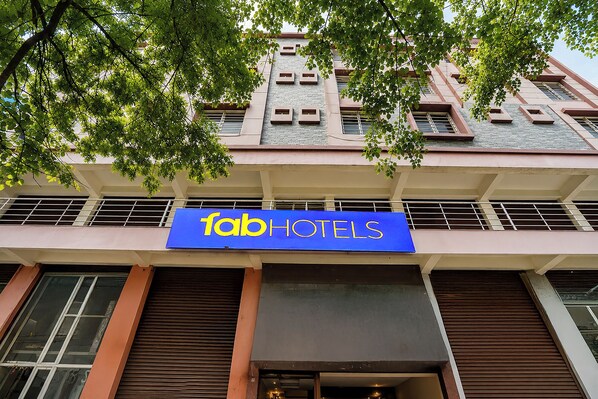 A hotel sign with the name 'Tab Hotels' on a blue background.