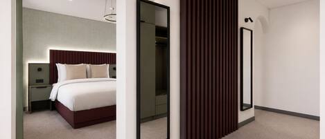 Una habitación de hotel moderna con cama, mesita de noche y un espejo grande.