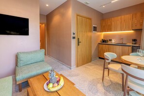 Superior Suite, Balcony, Mountain View | Living area | 43-inch Smart TV with satellite channels - Aetherion Suites (Chania)