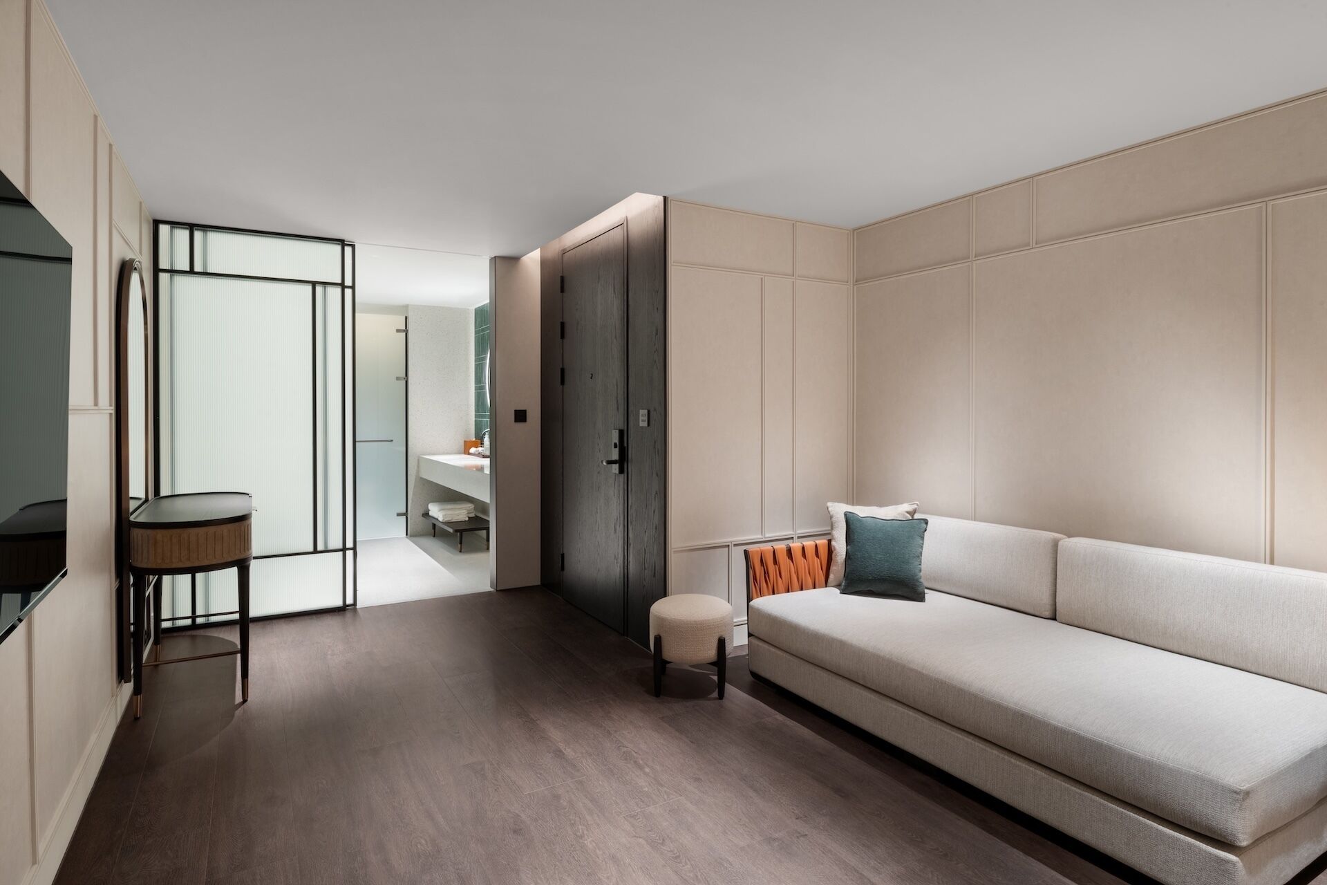 A modern interior with a sofa, a small table, and a cabinet.