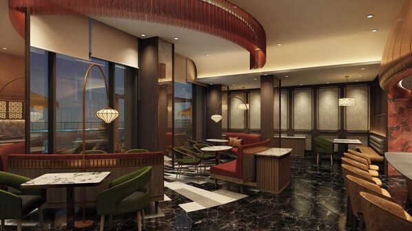 A modern interior with seating arrangements, tables, and decorative lighting fixtures.