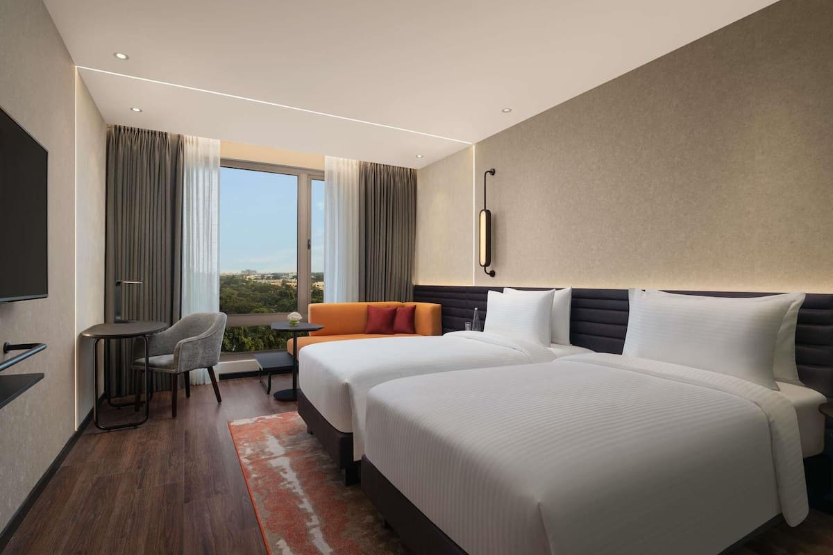Deluxe Room, 2 Twin Beds | Hypo-allergenic bedding available, down comforters, in-room safe