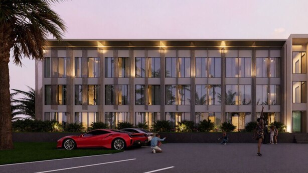 A modern building with a flat roof, large windows, and a parking area with a red sports car. - Tribe Na Tomba (Nadi)