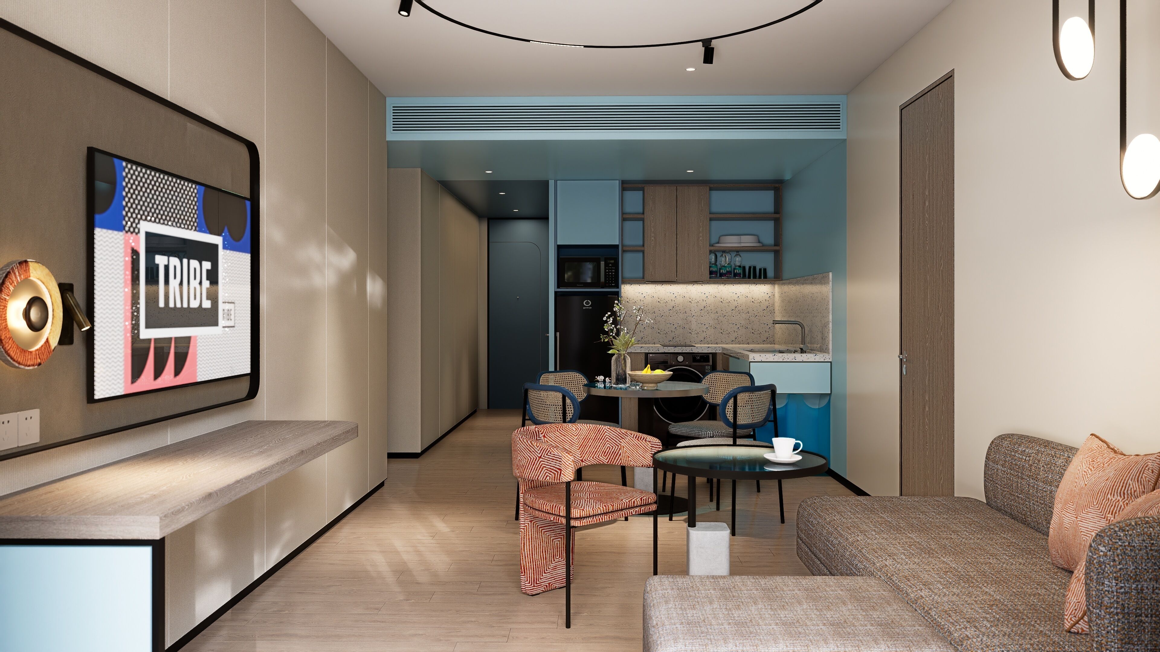 A modern living room with a sofa, chairs, a coffee table, and a TV mounted on the wall.