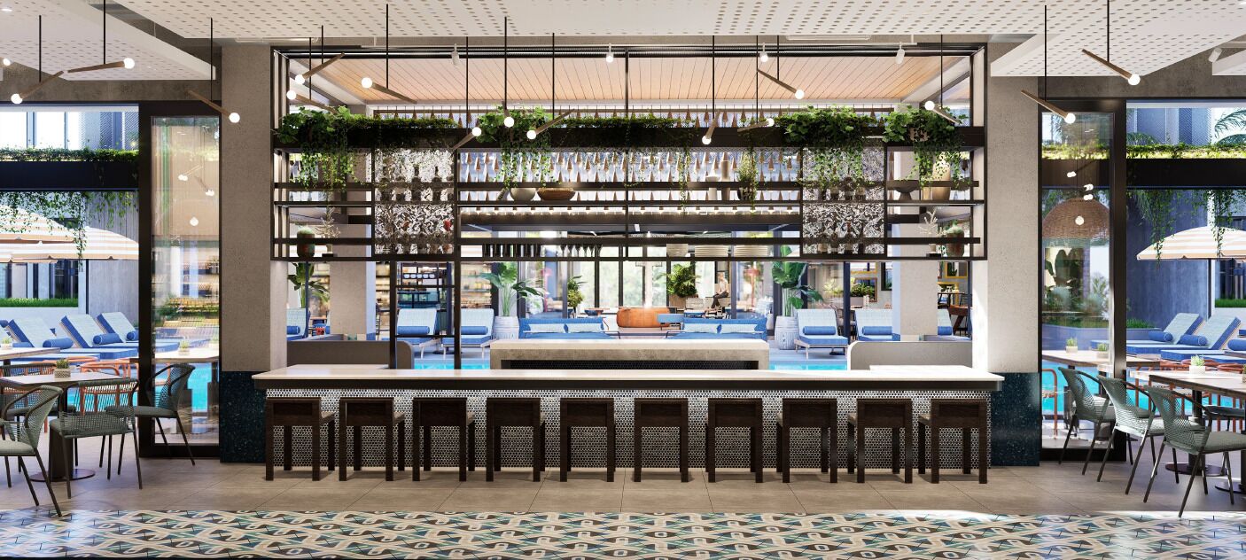 A modern bar area with a pool view, seating, and a decorative plant wall.