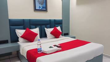 Deluxe Double Room, City View | In-room safe, desk, laptop workspace, iron/ironing board