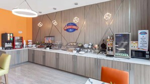 A breakfast counter with a Baymont sign, a coffee machine, and a microwave. - Stay Near Airport with Free Breakfast & Parking (Houston)