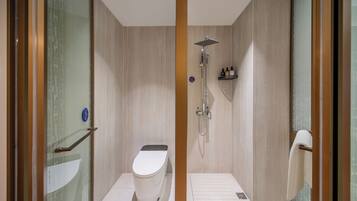 Kamar Single Comfort | Kamar mandi | Pengering rambut, handuk, sampo, dan tisu toilet