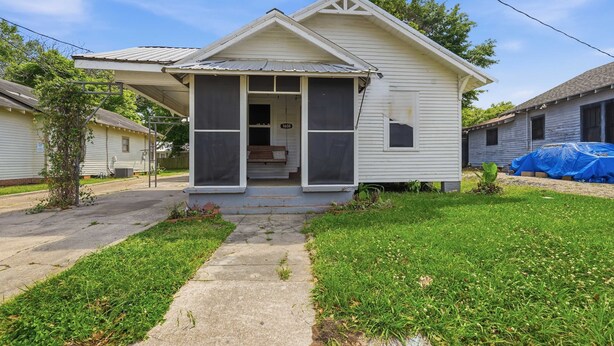 A single-story house with a front porch, a visible address sign, and a small front yard. - Affordable Private Room Near Downtown (Lafayette)