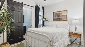 A bedroom with a bed, bedside table, lamp, and a painting on the wall. - Private Bedroom in 4BR Home (Lafayette)