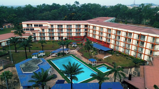 A hotel with multiple floors, a swimming pool, and a landscaped garden. - Landmark Nike Lake Resort (Enugu)