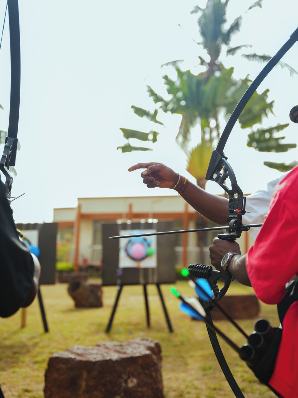 An outdoor archery range with targets and equipment.