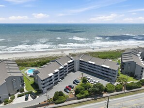 A hotel with a pool, parking, and ocean views. - Dunescape 132-Ocean Front Condo w/Pool (Atlantic Beach)
