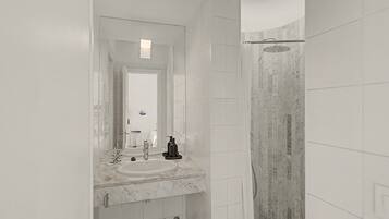 A modern bathroom with a large mirror, a sink, and a shower area.