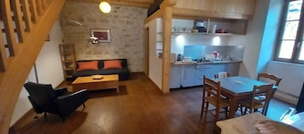 House near a river in a village