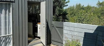Architect-designed cottage where sea meets forest