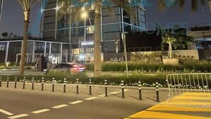 A modern high-rise building with a glass facade, surrounded by palm trees and a well-maintained landscaped area. - Spacious 2 bedroom at Creek Edge - All Bills Included for long stay (Dubai)