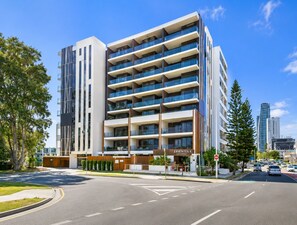 A multi-story hotel with a modern design, featuring a prominent entrance and a visible name sign. - Apt 2 - 18 Remembrance Drive - Surfers Paradise (Surfers Paradise)