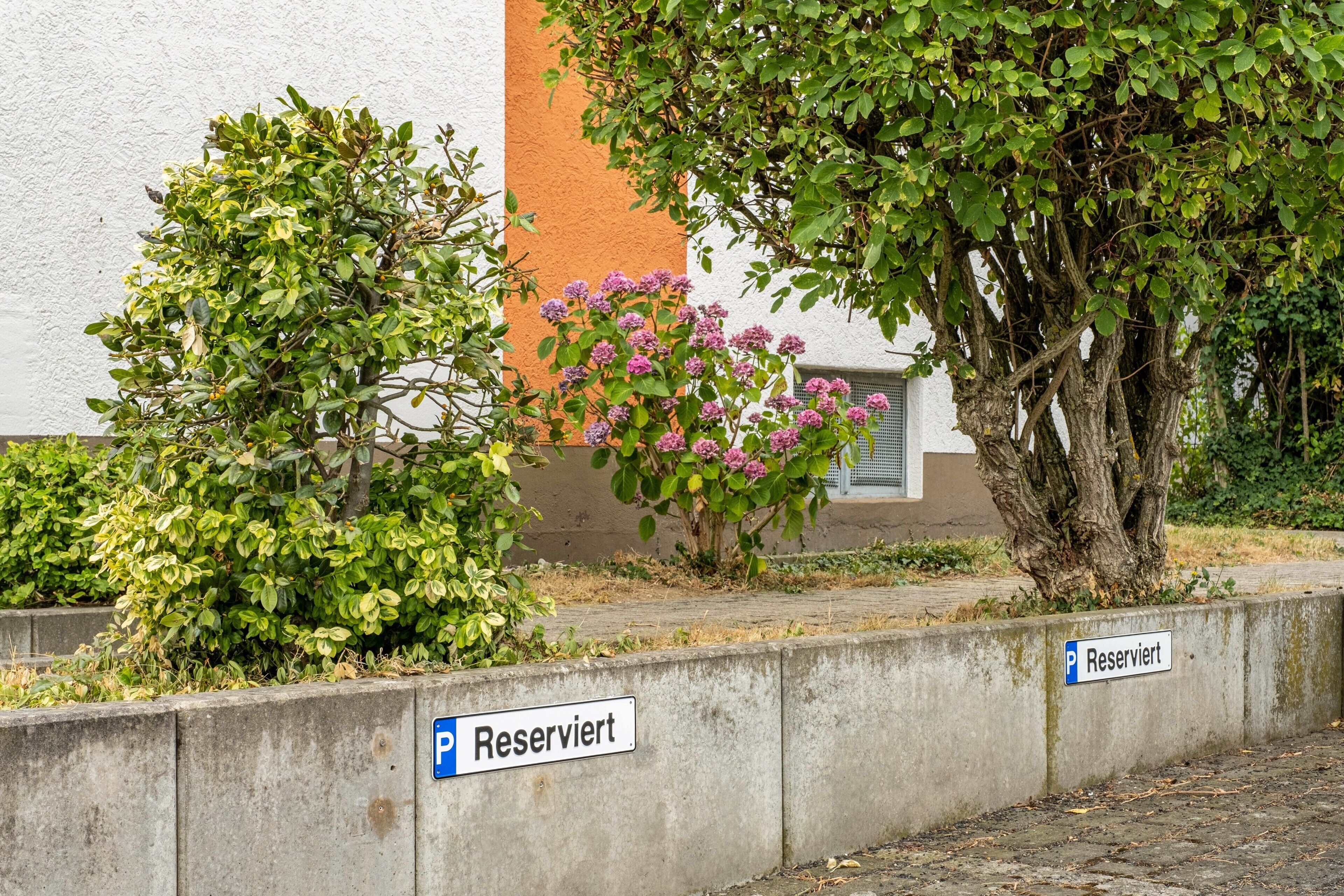 A parking area with a sign indicating it is reserved.