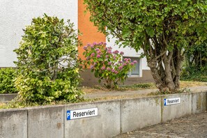 A parking area with a sign indicating it is reserved.