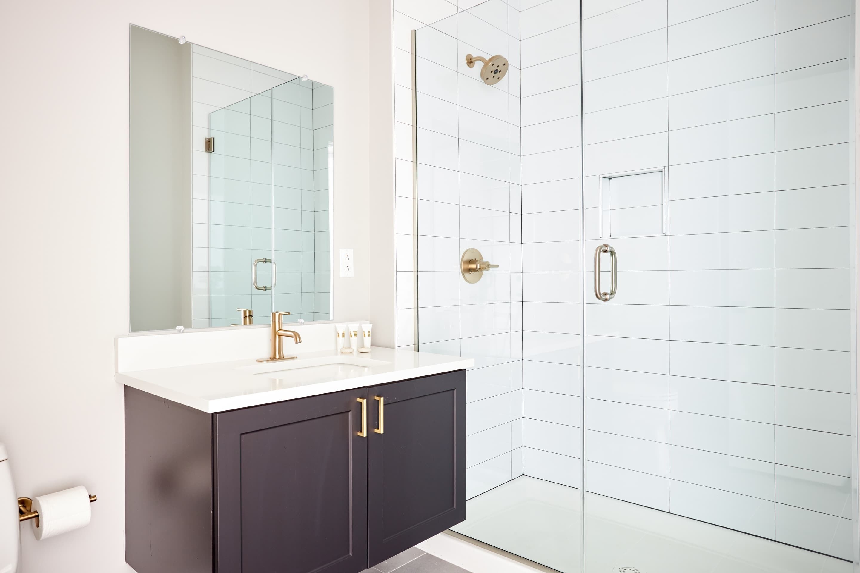Shower, hair dryer, towels, shampoo