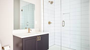 Shower, hair dryer, towels, shampoo
