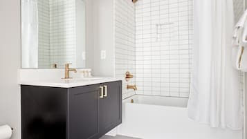 Shower, hair dryer, towels, shampoo