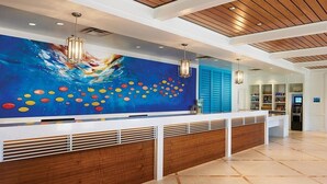 A reception area with a wooden ceiling, a large abstract painting, and a modern counter. - 1 Bedroom Villa at Harbour Lake Family-Friendly (ORLANDO)