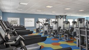 A gym with treadmills, weight machines, and a colorful hexagonal carpet. - 1 Bedroom Villa at Harbour Lake Family-Friendly (ORLANDO)