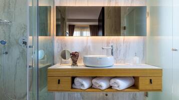 Superior Apartment, Balcony, Pool View | Bathroom | Shower, free toiletries, hair dryer, bathrobes