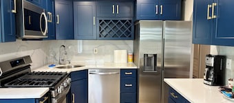 Spacious 4BR Home with Backyard. Near LIRR Direct to NYC 45 Mins. Malls & Shops!