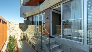 A modern building with a stone facade, large windows, and a glass balcony. - The Elara, Neutral Bay Isyd (Neutral Bay)